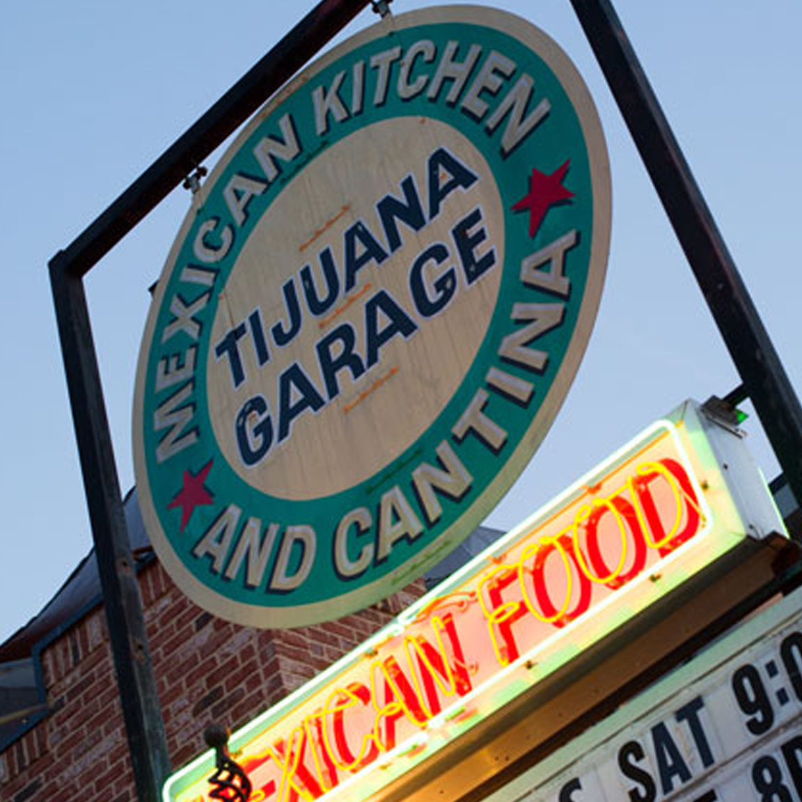 Tijuana Garage Sign at Dusk